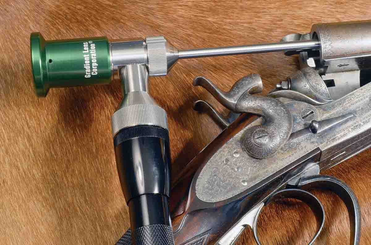 Inspecting the bore of black-powder rifles, like this James Woodward .450 Express 31⁄4 Inch (circa 1875), is extremely important. Until the advent of the borescope, it was almost impossible to clearly see the chamber and rifling.